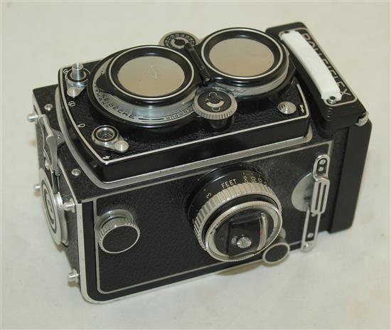 A Rolleiflex 3.5 Planar Xenotar camera and instruction book